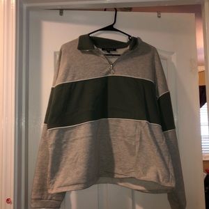 gray and green zip up sweatshirt